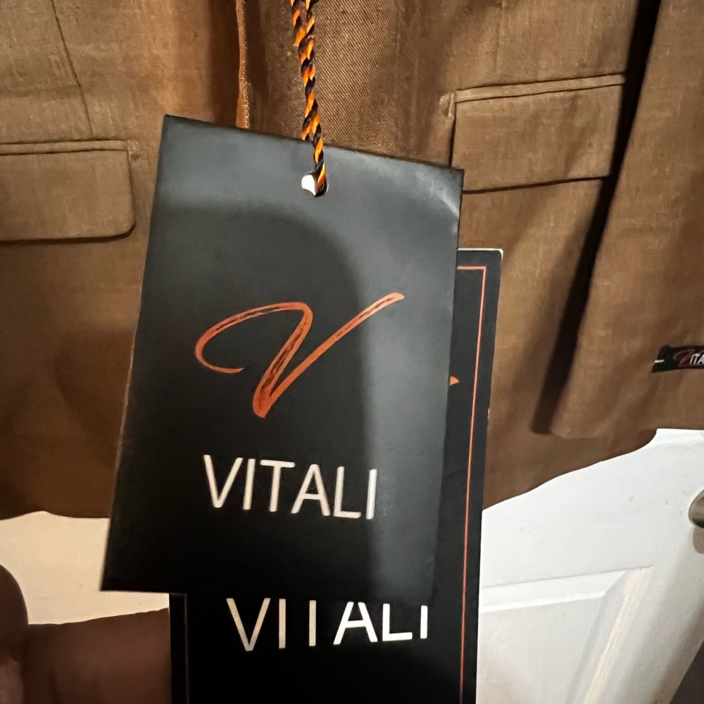 Tan Vitali suit piece suit new few wrinkles its been In the Portabella bag